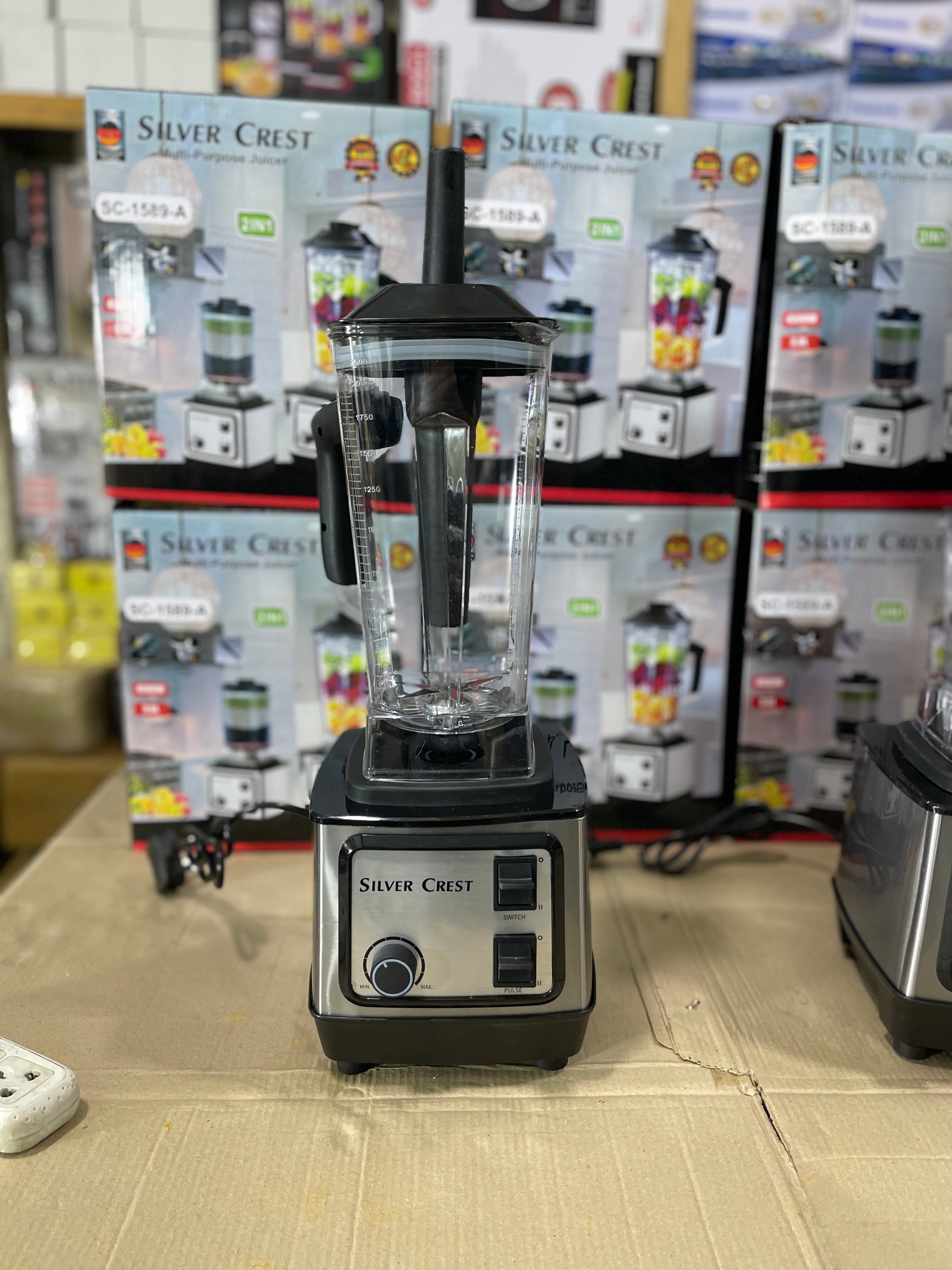 Silver Crest blender on display with product packaging in the background.